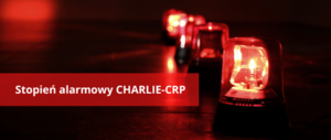 Czerwone syreny alarmowe i napis &quot;Stopień alarmowy CHARLIE-CRP&quot;